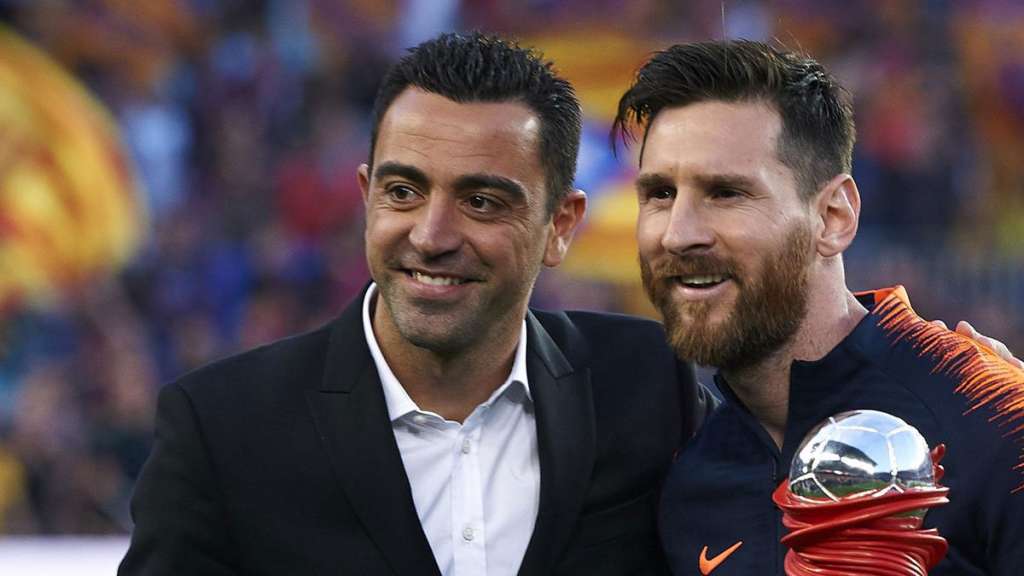 Xavi Hernández y Leo Messi