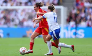 BASEL, SWITZERLAND - JULY 27: Mariona Caldentey of Spain runs with the ball whilst under pressure from Lauren Hemp of England during the UEFA Women's EURO 2025 Final match between England and Spain at St. Jakob-Park on July 27, 2025 in Basel, Switzerland. (Photo by Molly Darlington - UEFA/UEFA via Getty Images)
