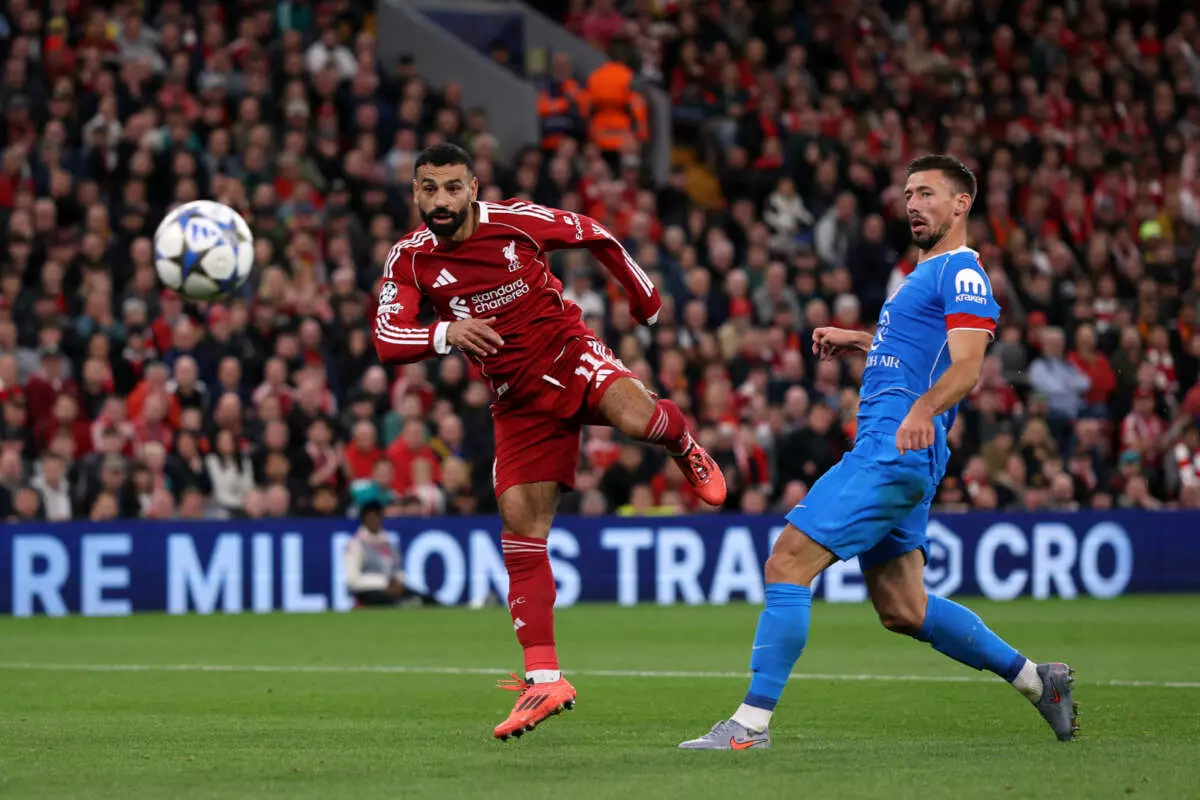LIVERPOOL, ENGLAND - SEPTEMBER 17: Mohamed Salah of Liverpool shoots past Clement Lenglet of Atletico de Madrid during the UEFA Champions League 2025/26 League Phase MD1 match between Liverpool FC and Atletico de Madrid at Anfield on September 17, 2025 in Liverpool, England. (Photo by Michael Regan - UEFA/UEFA via Getty Images)