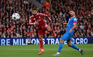 LIVERPOOL, ENGLAND - SEPTEMBER 17: Mohamed Salah of Liverpool shoots past Clement Lenglet of Atletico de Madrid during the UEFA Champions League 2025/26 League Phase MD1 match between Liverpool FC and Atletico de Madrid at Anfield on September 17, 2025 in Liverpool, England. (Photo by Michael Regan - UEFA/UEFA via Getty Images)