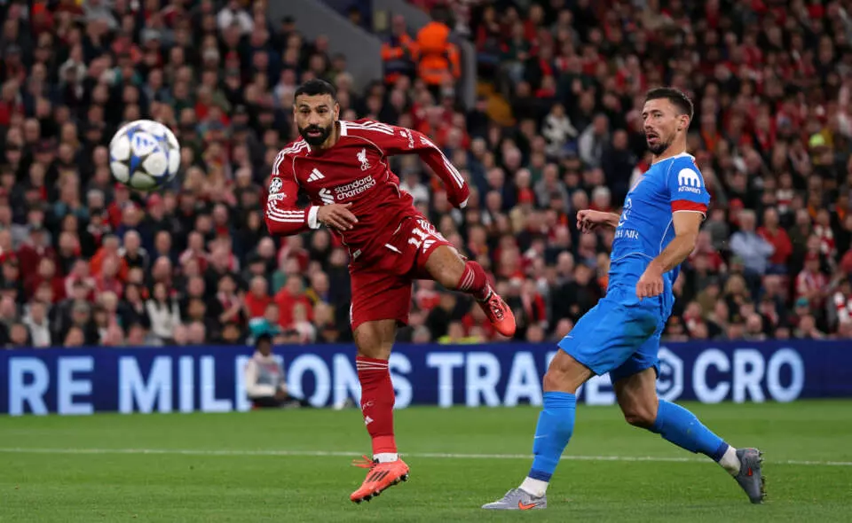 LIVERPOOL, ENGLAND - SEPTEMBER 17: Mohamed Salah of Liverpool shoots past Clement Lenglet of Atletico de Madrid during the UEFA Champions League 2025/26 League Phase MD1 match between Liverpool FC and Atletico de Madrid at Anfield on September 17, 2025 in Liverpool, England. (Photo by Michael Regan - UEFA/UEFA via Getty Images)