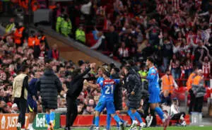 LIVERPOOL, ENGLAND - SEPTEMBER 17: Marcos Llorente of Atletico de Madrid celebrates scoring his team's second goal with Diego Simeone, Head Coach of Atletico de Madrid, and team mates during the UEFA Champions League 2025/26 League Phase MD1 match between Liverpool FC and Atletico de Madrid at Anfield on September 17, 2025 in Liverpool, England. (Photo by Michael Regan - UEFA/UEFA via Getty Images)