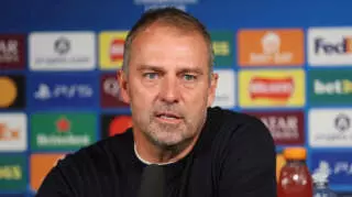 NEWCASTLE UPON TYNE, ENGLAND - SEPTEMBER 18: Hansi Flick, Head Coach of FC Barcelona, speaks to the media in a post match press conference following the UEFA Champions League 2025/26 League Phase MD1 match between Newcastle United FC and FC Barcelona at St James' Park on September 18, 2025 in Newcastle upon Tyne, England. (Photo by Michael Regan - UEFA/UEFA via Getty Images)