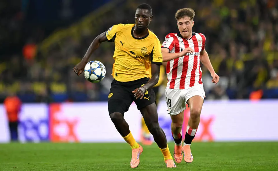 DORTMUND, GERMANY - OCTOBER 01: Serhou Guirassy of Borussia Dortmund controls the ball whilst under pressure from Mikel Jauregizar of Athletic Club during the UEFA Champions League 2025/26 League Phase MD2 match between Borussia Dortmund and Athletic Club at BVB Stadion Dortmund on October 01, 2025 in Dortmund, Germany. (Photo by Teresa Kröger - UEFA/UEFA via Getty Images)