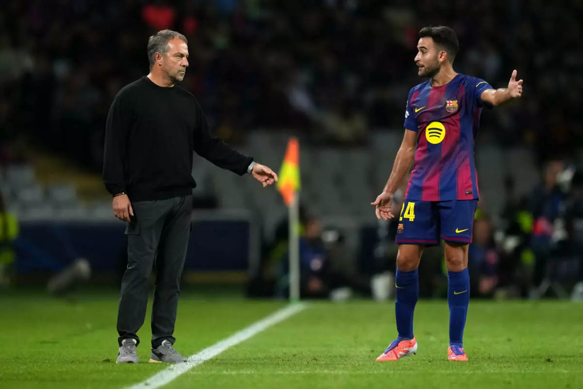BARCELONA, SPAIN - OCTOBER 01: Hansi Flick, Head Coach of FC Barcelona, interacts with Eric Garcia of FC Barcelona during the UEFA Champions League 2025/26 League Phase MD2 match between FC Barcelona and Paris Saint-Germain at Estadi Olimpic Lluis Companys on October 01, 2025 in Barcelona, Spain. (Photo by Alex Caparros - UEFA/UEFA via Getty Images)