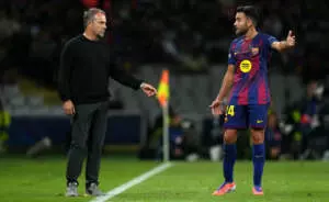 BARCELONA, SPAIN - OCTOBER 01: Hansi Flick, Head Coach of FC Barcelona, interacts with Eric Garcia of FC Barcelona during the UEFA Champions League 2025/26 League Phase MD2 match between FC Barcelona and Paris Saint-Germain at Estadi Olimpic Lluis Companys on October 01, 2025 in Barcelona, Spain. (Photo by Alex Caparros - UEFA/UEFA via Getty Images)