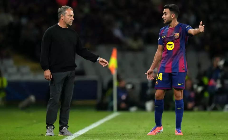 BARCELONA, SPAIN - OCTOBER 01: Hansi Flick, Head Coach of FC Barcelona, interacts with Eric Garcia of FC Barcelona during the UEFA Champions League 2025/26 League Phase MD2 match between FC Barcelona and Paris Saint-Germain at Estadi Olimpic Lluis Companys on October 01, 2025 in Barcelona, Spain. (Photo by Alex Caparros - UEFA/UEFA via Getty Images)