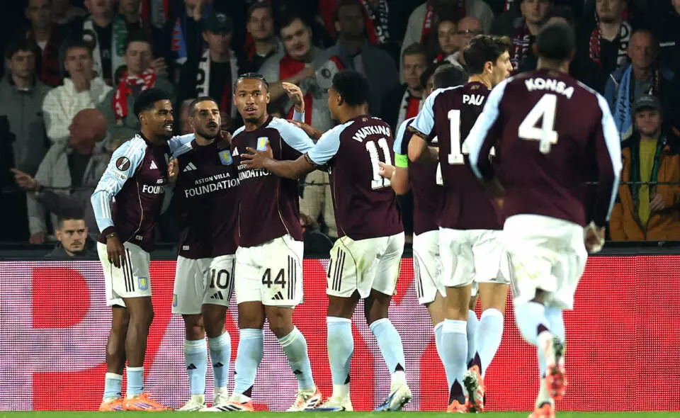 ROTTERDAM, NETHERLANDS - OCTOBER 02: Emiliano Buendia of Aston Villa celebrates scoring his team's first goal with teammates Ian Maatsen and Boubacar Kamara during the UEFA Europa League 2025/26 League Phase MD2 match between Feyenoord and Aston Villa FC at De Kuip on October 02, 2025 in Rotterdam, Netherlands. (Photo by Lars Baron - UEFA/UEFA via Getty Images)