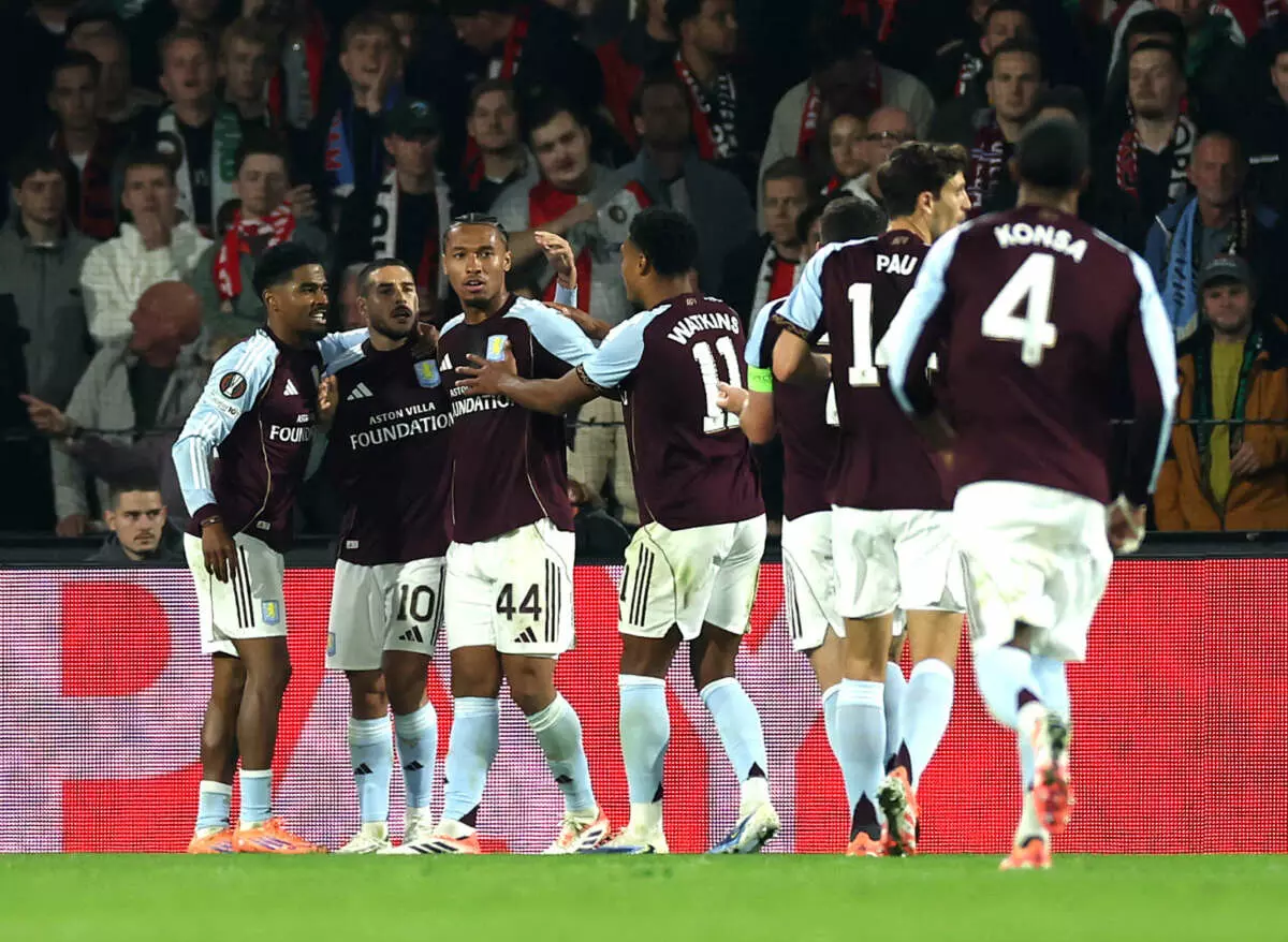 ROTTERDAM, NETHERLANDS - OCTOBER 02: Emiliano Buendia of Aston Villa celebrates scoring his team's first goal with teammates Ian Maatsen and Boubacar Kamara during the UEFA Europa League 2025/26 League Phase MD2 match between Feyenoord and Aston Villa FC at De Kuip on October 02, 2025 in Rotterdam, Netherlands. (Photo by Lars Baron - UEFA/UEFA via Getty Images)