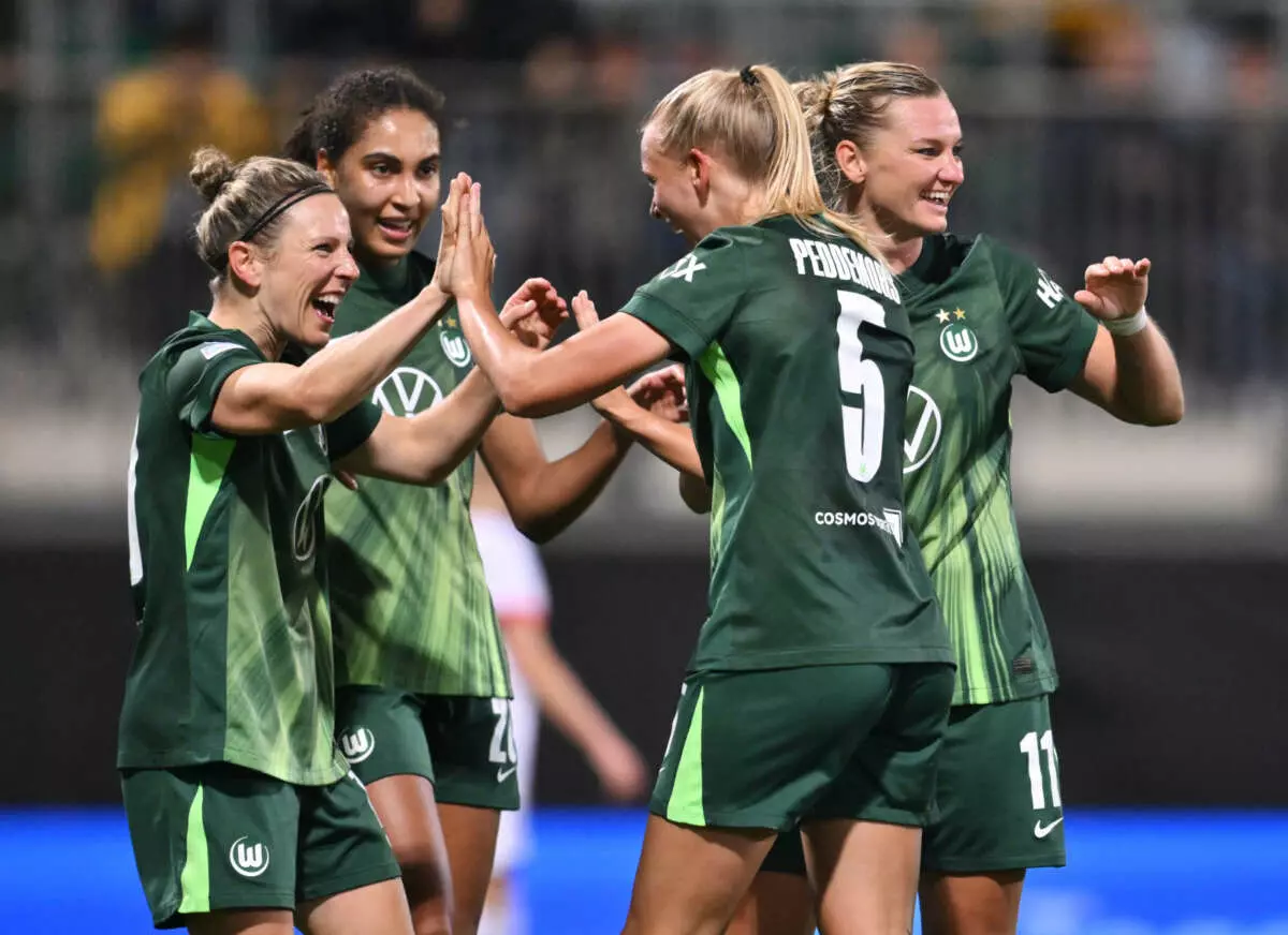 WOLFSBURG, GERMANY - OCTOBER 08: Ella Peddemors of VfL Wolfsburg celebrates scoring her sides second goal with teammates during the UEFA Women's Champions League 2025/26 league phase match between VfL Wolfsburg and Paris Saint-Germain at AOK Stadion on October 08, 2025 in Wolfsburg, Germany. (Photo by Oliver Hardt - UEFA/UEFA via Getty Images)