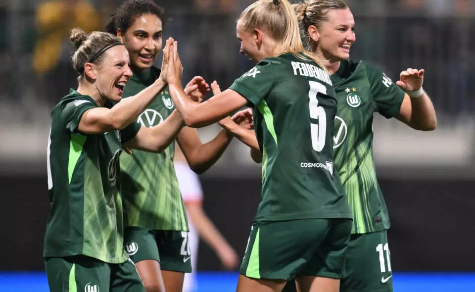 WOLFSBURG, GERMANY - OCTOBER 08: Ella Peddemors of VfL Wolfsburg celebrates scoring her sides second goal with teammates during the UEFA Women's Champions League 2025/26 league phase match between VfL Wolfsburg and Paris Saint-Germain at AOK Stadion on October 08, 2025 in Wolfsburg, Germany. (Photo by Oliver Hardt - UEFA/UEFA via Getty Images)