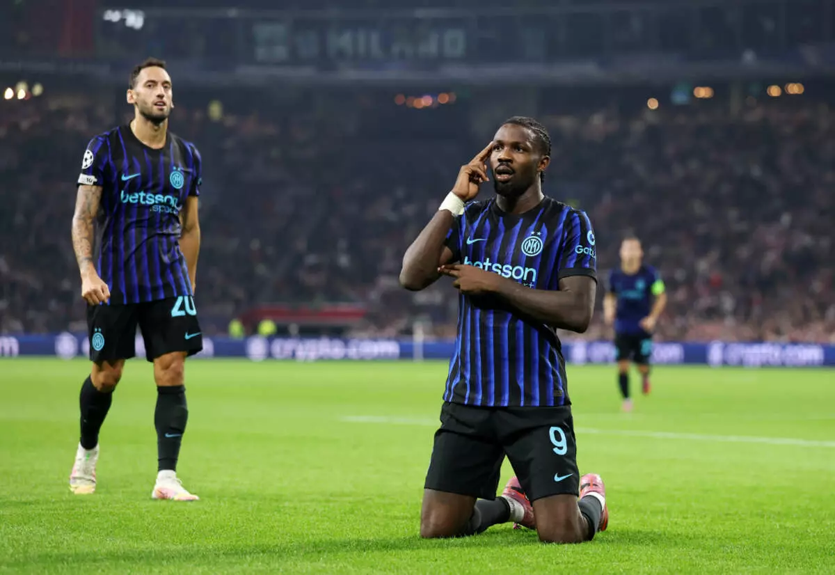 AMSTERDAM, NETHERLANDS - SEPTEMBER 17: Marcus Thuram of Internazionale celebrates scoring his team's first goal during the UEFA Champions League 2025/26 League Phase MD1 match between AFC Ajax and FC Internazionale Milano at Johan Cruijff Arena on September 17, 2025 in Amsterdam, Netherlands. (Photo by Lars Baron - UEFA/UEFA via Getty Images)