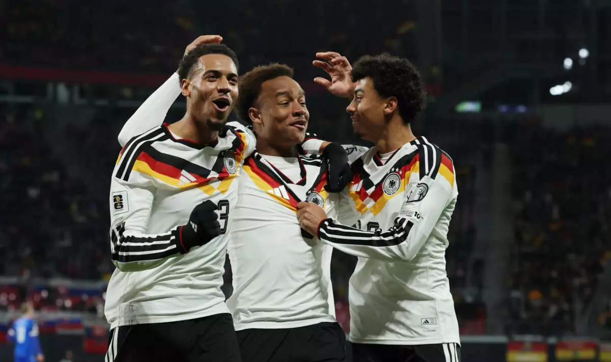 LEIPZIG, GERMANY - NOVEMBER 17: Assan Ouedraogo of Germany celebrates scoring his team's sixth goal with teammates Felix Nmecha and Nathaniel Brown during the FIFA World Cup 2026 qualifier match between Germany and Slovakia at Red Bull Arena on November 17, 2025 in Leipzig, Germany. (Photo by Boris Streubel - UEFA/UEFA via Getty Images)