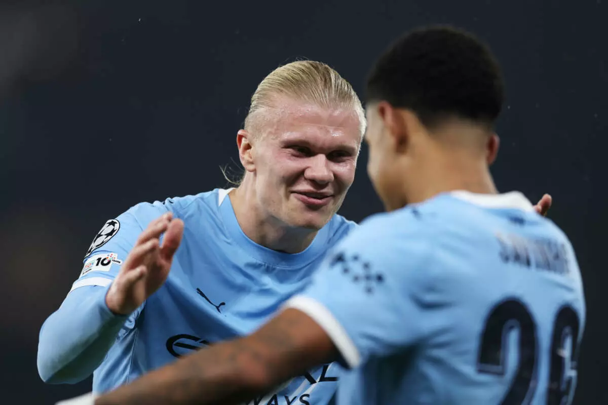 MANCHESTER, ENGLAND - NOVEMBER 05: Erling Haaland of Manchester City celebrates with teammate Savio after Phil Foden (not pictured) scored his team's third goal during the UEFA Champions League 2025/26 League Phase MD4 match between Manchester City and Borussia Dortmund at City of Manchester Stadium on November 05, 2025 in Manchester, England. (Photo by Michael Regan - UEFA/UEFA via Getty Images)