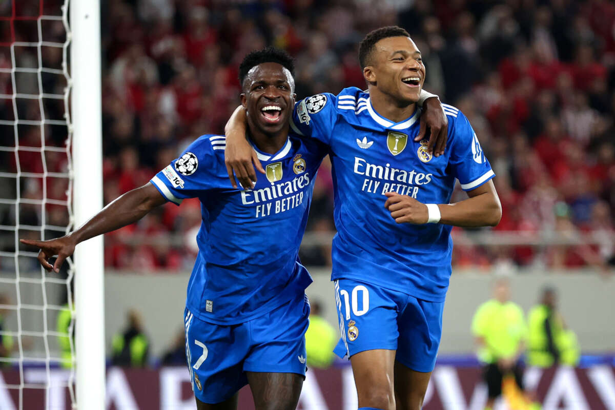 PIRAEUS, GREECE - NOVEMBER 26: Kylian Mbappe of Real Madrid (L) celebrates scoring his team's fourth goal with teammate Vinicius Junior (L) during the UEFA Champions League 2025/26 League Phase MD5 match between Olympiacos FC and Real Madrid C.F. at Stadio Georgios Karaiskakis on November 26, 2025 in Piraeus, Greece. (Photo by Alex Pantling - UEFA/UEFA via Getty Images)