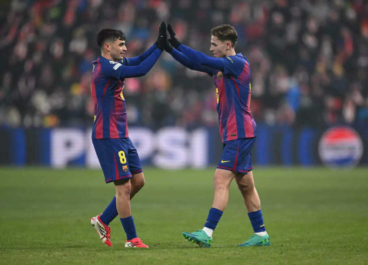 PRAGUE, CZECH REPUBLIC - JANUARY 21: Fermin Lopez of FC Barcelona celebrates scoring his team's second goal with teammate Pedri during the UEFA Champions League 2025/26 League Phase MD7 match between SK Slavia Praha and FC Barcelona at Eden Arena on January 21, 2026 in Prague, Czech Republic. (Photo by Thomas Eisenhuth - UEFA/UEFA via Getty Images)
