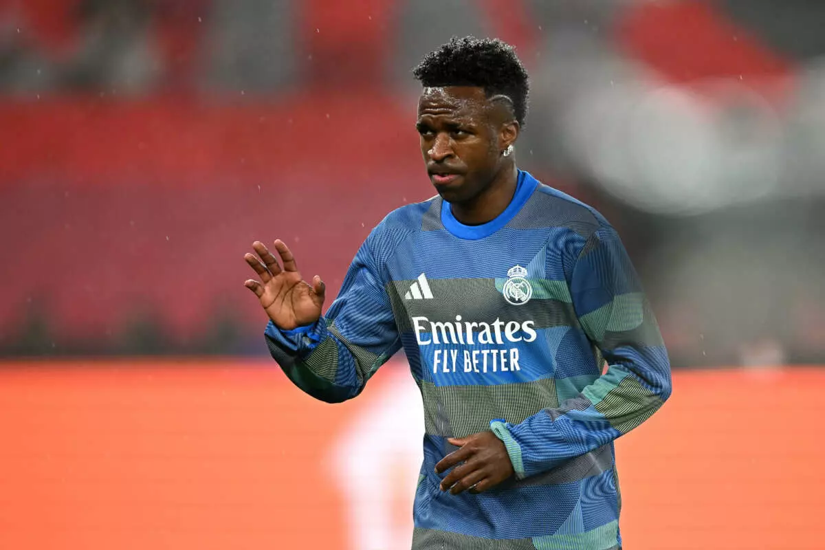 LISBON, PORTUGAL - JANUARY 28: Vinicius Junior of Real Madrid gestures as he warms up prior to the UEFA Champions League 2025/26 League Phase MD8 match between SL Benfica and Real Madrid C.F. at Estadio do SL Benfica on January 28, 2026 in Lisbon, Portugal. (Photo by Octavio Passos - UEFA/UEFA via Getty Images)