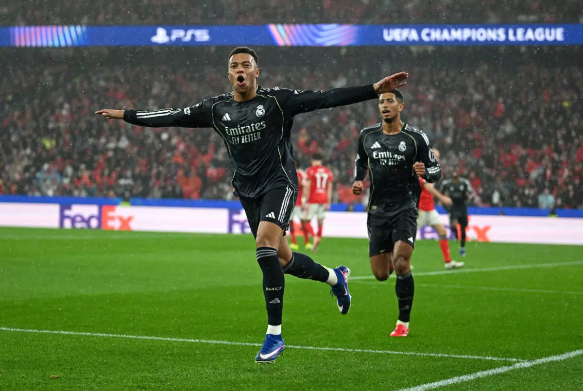 LISBON, PORTUGAL - JANUARY 28: Kylian Mbappe of Real Madrid celebrates scoring his team's first goal with with teammate Jude Bellingham during the UEFA Champions League 2025/26 League Phase MD8 match between SL Benfica and Real Madrid C.F. at Estadio do SL Benfica on January 28, 2026 in Lisbon, Portugal. (Photo by Octavio Passos - UEFA/UEFA via Getty Images)