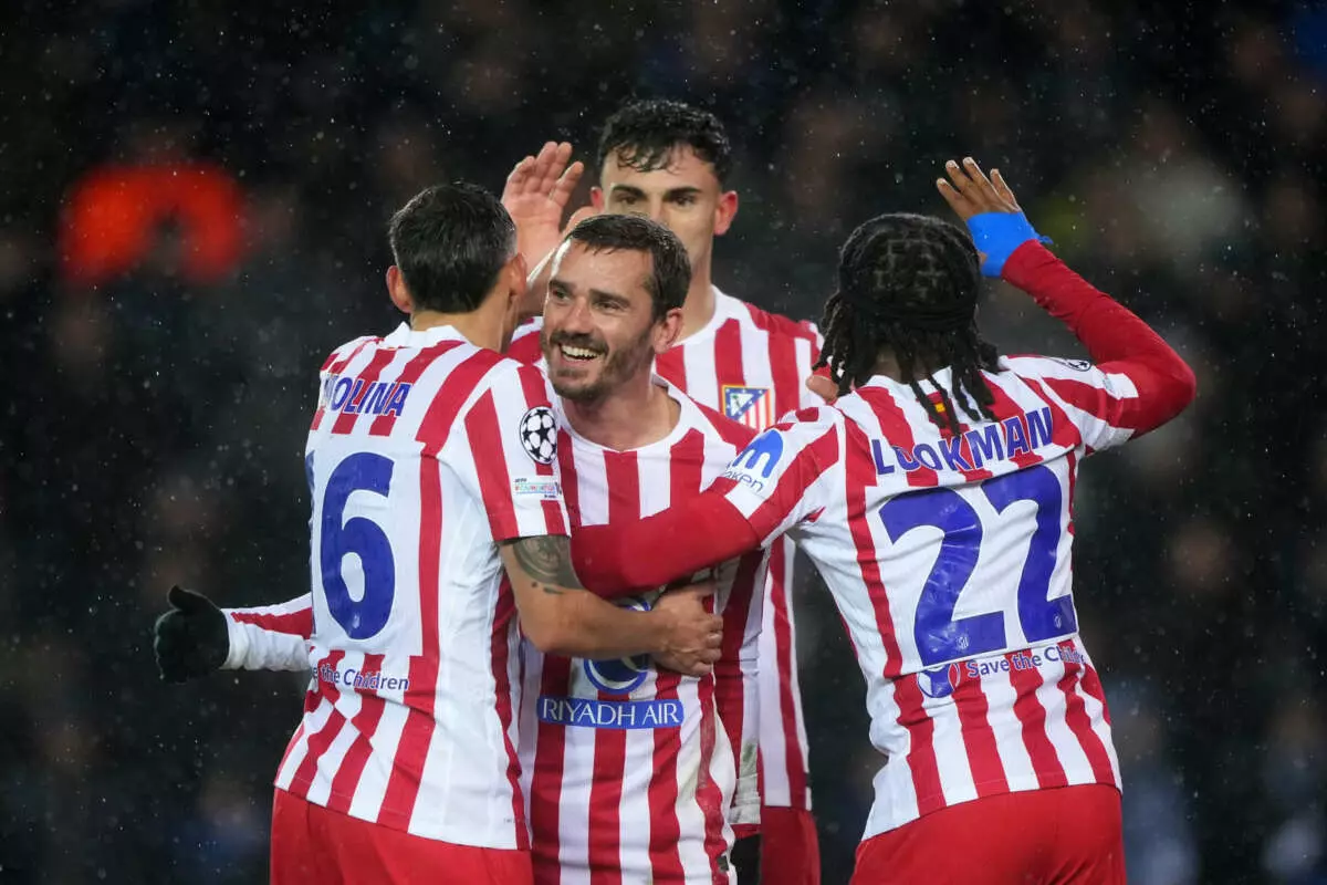 BRUGES, BELGIUM - FEBRUARY 18: Ademola Lookman of Atletico de Madrid celebrates scoring his team's second goal with teammates during the UEFA Champions League 2025/26 League Knockout Play-off First Leg match between Club Brugge KV and Atletico de Madrid at Jan Breydelstadion on February 18, 2026 in Bruges, Belgium. (Photo by Alex Bierens de Haan - UEFA/UEFA via Getty Images)