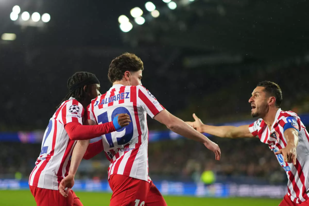BRUGES, BELGIUM - FEBRUARY 18: Julian Alvarez of Atletico de Madrid celebrates scoring his team's first goal with teammates during the UEFA Champions League 2025/26 League Knockout Play-off First Leg match between Club Brugge KV and Atletico de Madrid at Jan Breydelstadion on February 18, 2026 in Bruges, Belgium. (Photo by Alex Bierens de Haan - UEFA/UEFA via Getty Images)