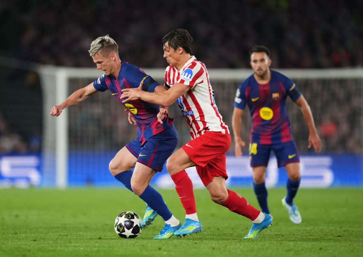 BARCELONA, SPAIN - APRIL 08: Dani Olmo of FC Barcelona is challenged by Robin Le Normand of Atletico de Madrid during the UEFA Champions League 2025/26 Quarter-Final First Leg match between FC Barcelona and Club Atlético de Madrid at Camp Nou on April 08, 2026 in Barcelona, Spain. (Photo by Alex Caparros - UEFA/UEFA via Getty Images)