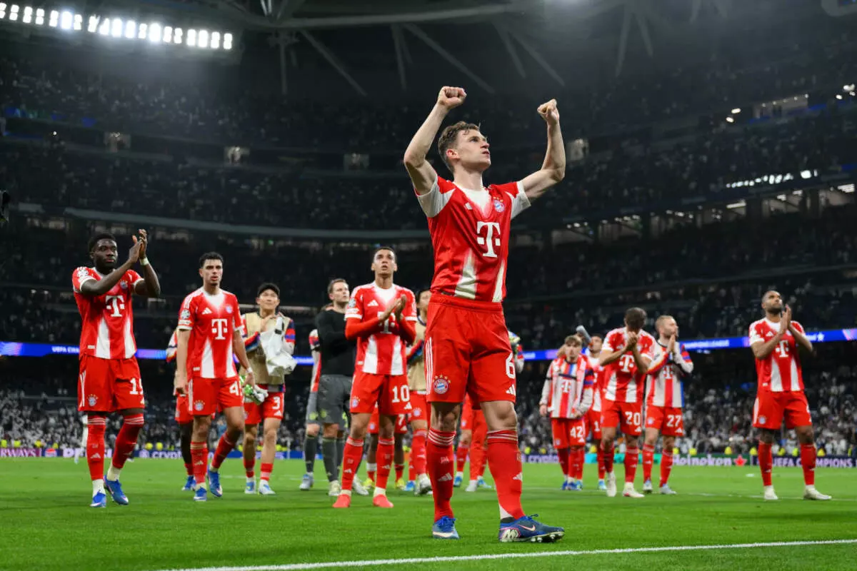 MADRID, SPAIN - APRIL 07: Joshua Kimmich of FC Bayern Munich acknowledges the fans after the team's victory in the UEFA Champions League 2025/26 Quarter-Final First Leg match between Real Madrid CF and FC Bayern München at Estadio Santiago Bernabeu on April 07, 2026 in Madrid, Spain. (Photo by David Ramos - UEFA/UEFA via Getty Images)